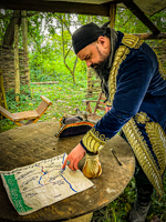 Player character reading a map in the forest